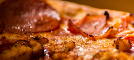 Close up on delicious pizza in cardboard, pizza delivered to your home in a special packaging, fast foodの写真素材