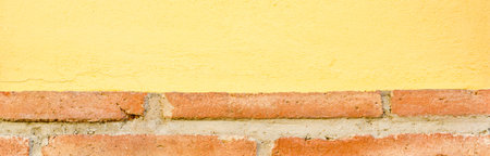 Old brick placed in the wall, interesting and original background, solid wall