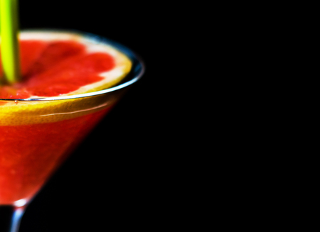 Healthy smoothie with ripe pomelo fruit in a glass, a drink decorated with a slice of pomelo, pink drinkの写真素材