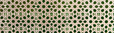 Traditional ornamental Spanish decorative tiles, original ceramic tiles on the walls of buildings,...