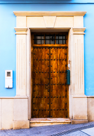 Old door with interesting texture, element of architecture, interesting entrance to the building, vintage style, entranceの写真素材