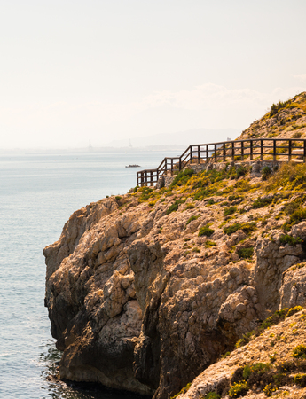 Wooden promenade along the sea coast situated on a cliff rock in Rincon de la Victoria, Costa del Sol, Andalucja, Spainの写真素材
