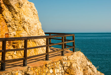 Wooden promenade along the sea coast situated on a cliff rock in Rincon de la Victoria, Costa del Sol, Andalucja, Spainの写真素材