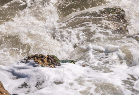 Amazing sea with blue summer wave and rocks, relaxing view of rocks and water, nature