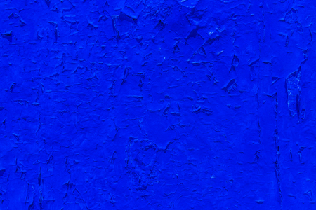 Old flaky paint peeling off on old wall, cracks and scrapes on the surface, vintageの写真素材