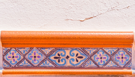Traditional ornamental Spanish decorative tiles, original ceramic tiles on the walls of buildings, decorationの写真素材