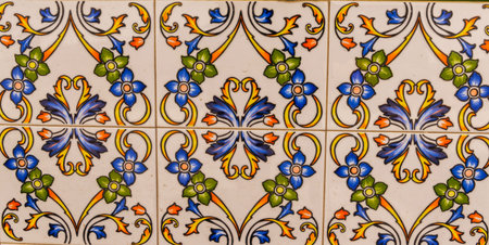 Traditional ornamental Spanish decorative tiles, original ceramic tiles on the walls of buildings,...