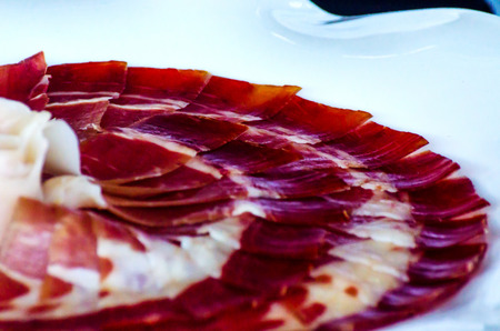 Plate with cut slices of jamon serrano, traditional Spanish ham, meatの写真素材