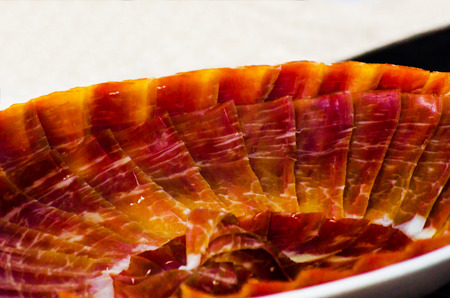 Plate with cut slices of jamon serrano, traditional Spanish ham, meatの写真素材