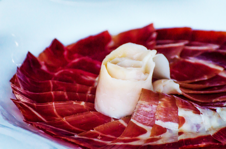 Plate with cut slices of jamon serrano, traditional Spanish ham, meatの写真素材