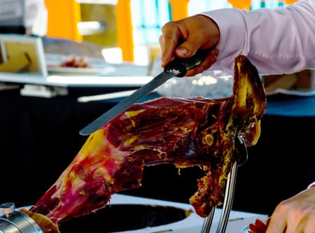 Professional chef slicing jamon serrano, traditional Spanish ham, meatの写真素材