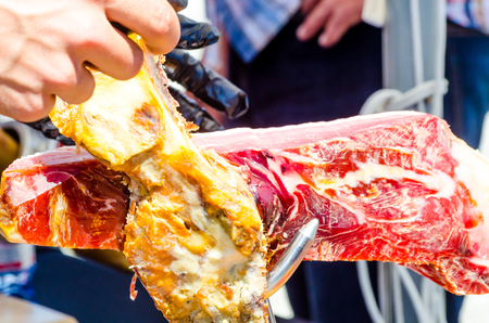 Professional chef slicing jamon serrano, traditional Spanish ham, meatの写真素材