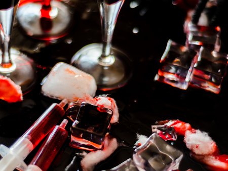 Creepy Halloween party cocktails with blood and ice cubes, drinks at partyの写真素材