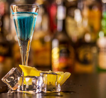 Refreshing liqueur in a tall glass, alcoholic drink prepared by the bartender, nightlifeの写真素材