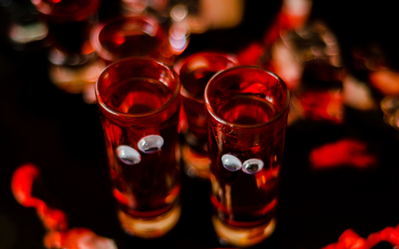 Creepy Halloween party cocktails with blood and eyes, drinks at party, scary barの写真素材