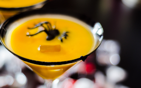 Creepy Halloween party cocktails with blood, spiders and ice cubes, drinks at partyの写真素材