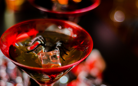 Creepy Halloween party cocktails with blood, spiders and ice cubes, drinks at partyの写真素材