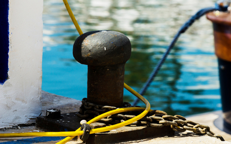 Mooring post on the waterfront in a small marina, element for mooring ships in the harbor, safetyの写真素材