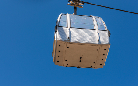 Cableway against the sky, transport at height and tourist attraction, travelの写真素材