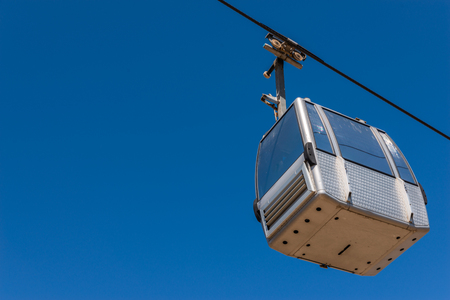 Cableway against the sky, transport at height and tourist attraction, travelの写真素材