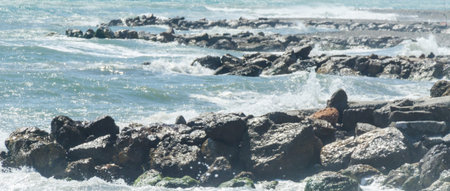 Amazing sea with blue summer wave and rocks, relaxing view of rocks and water, nature