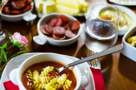 Tasty and nutritious tomato soup with fresh pasta, dietary meal, vegetarian lunchの写真素材