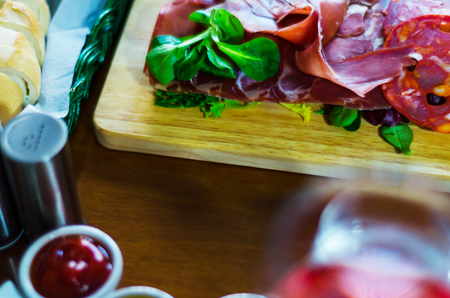 Board of meats and other starters, a variety of small dishes, a set of appetizers, a tasty setの写真素材