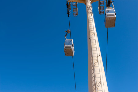 Cableway against the sky, transport at height and tourist attraction, travel