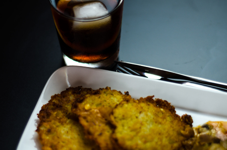 Potato pancakes with spicy stew, delicious traditional dish, Hungarian cuisine, tasty mealの写真素材