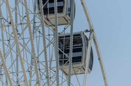 Big wheel in the seaside village, in the background clean blue sky, sunny dayの写真素材