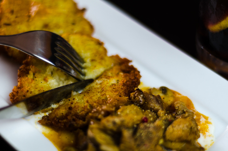 Potato pancakes with spicy stew, delicious traditional dish, Hungarian cuisine, tasty mealの写真素材