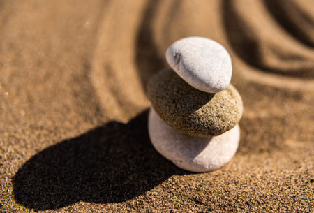 Zen meditation stone in sand, concept for purity harmony and spirituality, spa wellness and yoga background, harmonyの写真素材