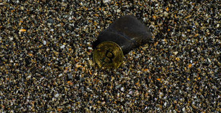 Crypto currency Gold Bitcoin, BTC, macro shot of Bitcoin coins on beach background,  bitcoin mining conceptの写真素材