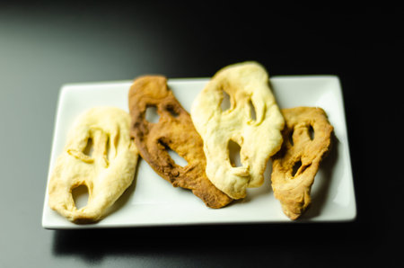 Cakes in the shape of ghosts, typical sweets on Halloween, creepy food