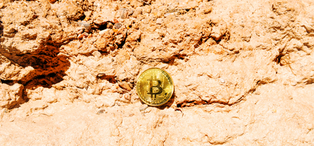 Crypto currency Gold Bitcoin, BTC, macro shot of Bitcoin coins on rock background,  bitcoin mining conceptの写真素材