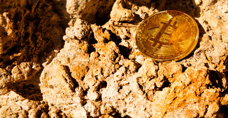 Crypto currency Gold Bitcoin, BTC, macro shot of Bitcoin coins on rock background,  bitcoin mining conceptの写真素材