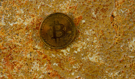 Crypto currency Gold Bitcoin, BTC, macro shot of Bitcoin coins on rock background,  bitcoin mining conceptの写真素材