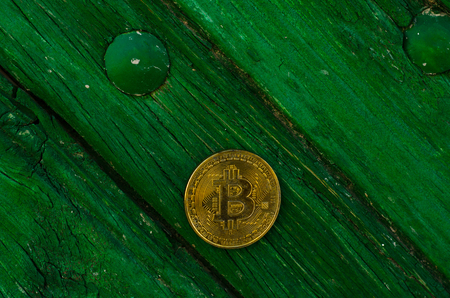 Crypto currency Gold Bitcoin, BTC, macro shot of Bitcoin coins on wooden background,  bitcoin mining conceptの写真素材