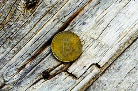 Crypto currency Gold Bitcoin, BTC, macro shot of Bitcoin coins on wooden background,  bitcoin mining conceptの写真素材