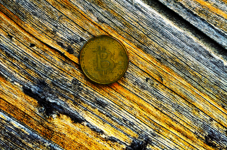 Crypto currency Gold Bitcoin, BTC, macro shot of Bitcoin coins on wooden background,  bitcoin mining conceptの写真素材