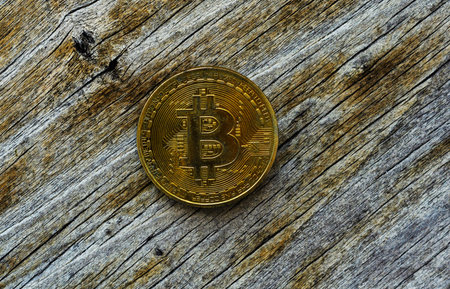 Crypto currency Gold Bitcoin, BTC, macro shot of Bitcoin coins on wooden background,  bitcoin mining...