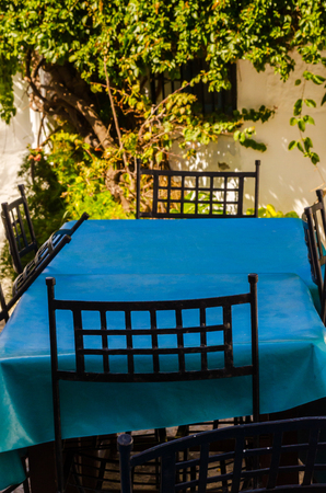 Empty tables and chairs in front of the restaurant place to serve meals outside the restaurant, catering industryの写真素材