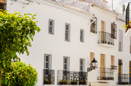Stylish balcony with a metal railing, solid architectural element, a place of rest and relaxation, vintage decor, balconyの写真素材