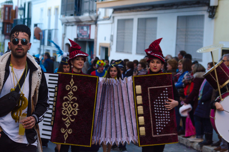 NERJA, SPAIN - FEBRUARY 10, 2018People in costumes celebrating carnival in Malaga province, carnival paradeのeditorial素材