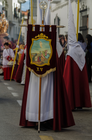 VELEZ-MALAGA, SPAIN - MARCH 25, 2018 People participating in the procession connected in a holy week in a Spanish city, easterのeditorial素材