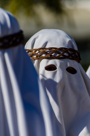 VELEZ-MALAGA, SPAIN - MARCH 27, 2018 People participating in the procession  in the Holy Week in a Spanish city, easterのeditorial素材