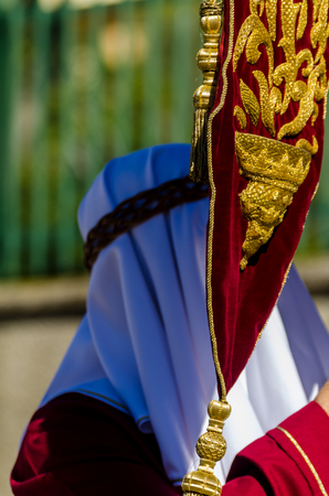 VELEZ-MALAGA, SPAIN - MARCH 27, 2018 People participating in the procession  in the Holy Week in a Spanish city, easterのeditorial素材