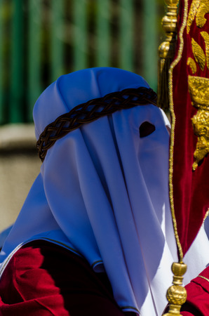 VELEZ-MALAGA, SPAIN - MARCH 27, 2018 People participating in the procession  in the Holy Week in a Spanish city, easterのeditorial素材