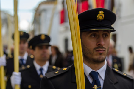 VELEZ-MALAGA, SPAIN - MARCH 25, 2018 People participating in the procession  in the Holy Week in a Spanish city, easterのeditorial素材