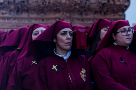 VELEZ-MALAGA, SPAIN - MARCH 25, 2018 People participating in the procession  in the Holy Week in a...